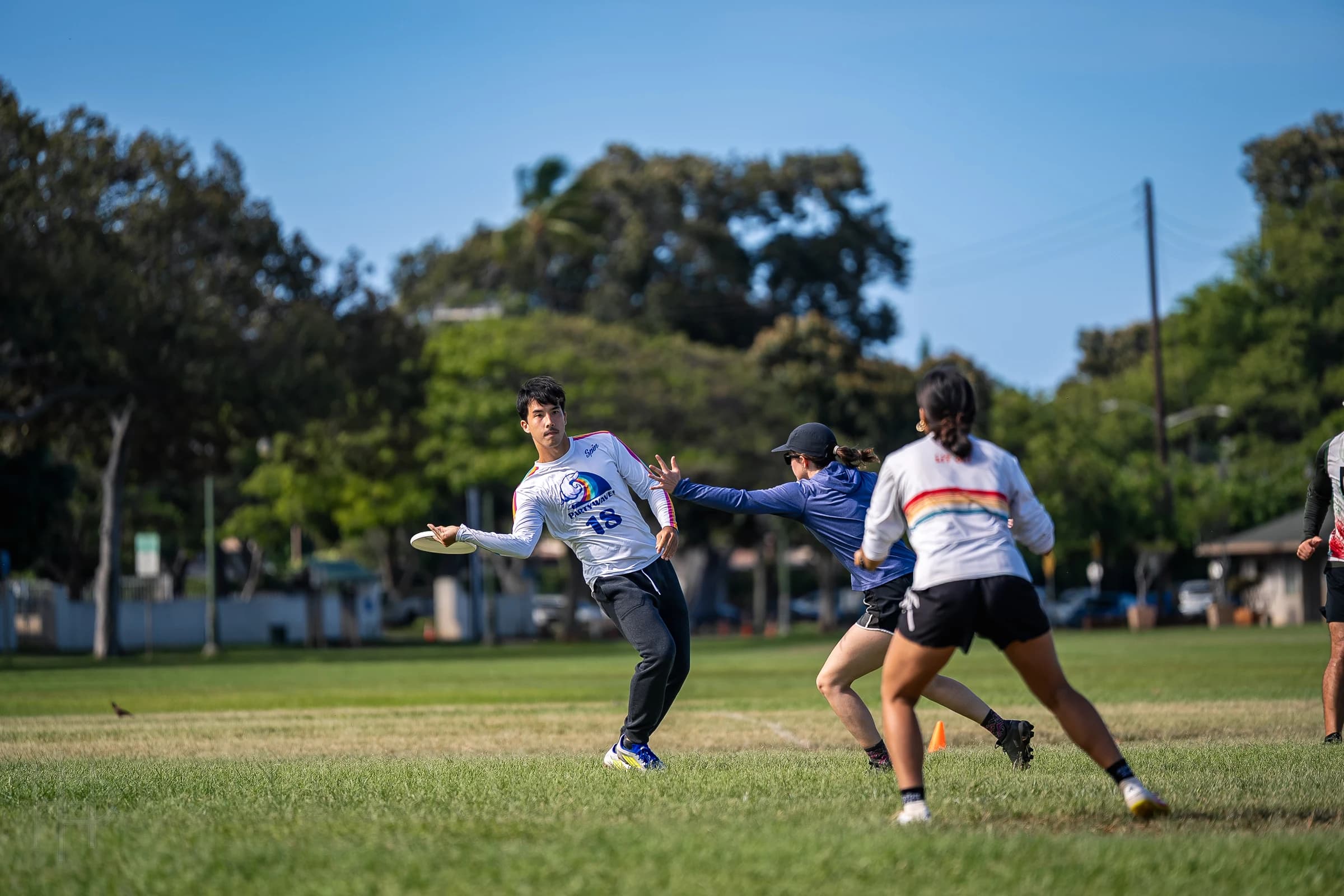 Ultimate players in motion during a game in Honolulu
