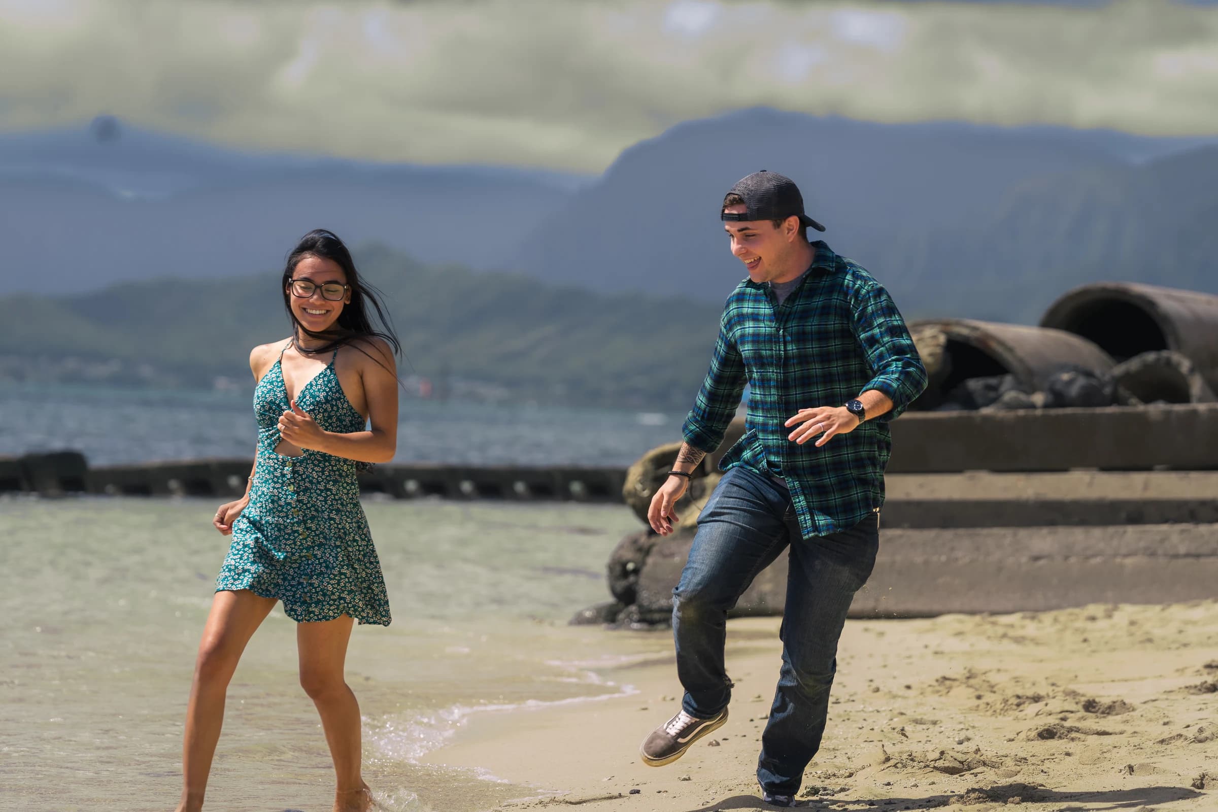 Couple moving through a windward landscape