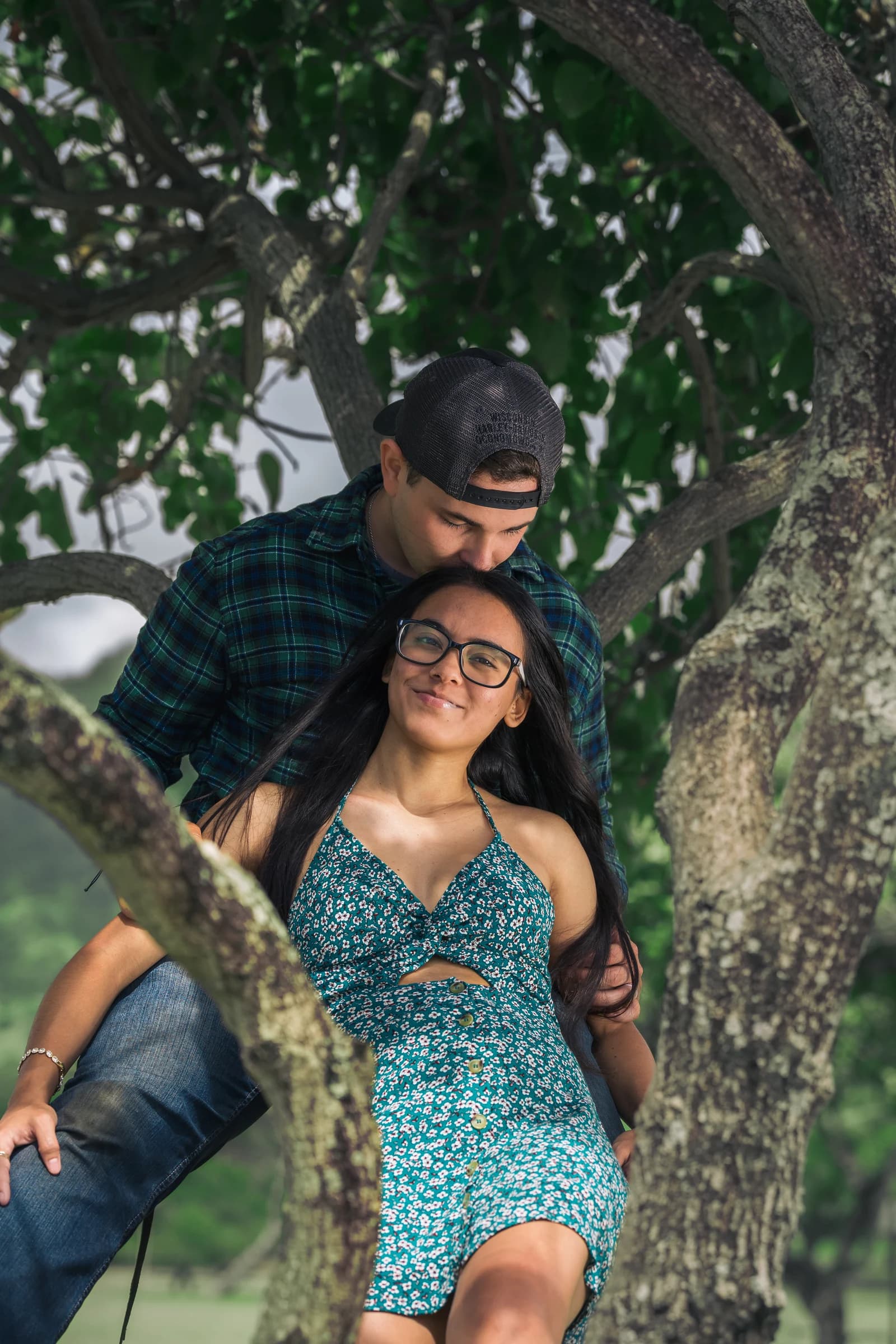 Couple in a quiet moment beneath a tree