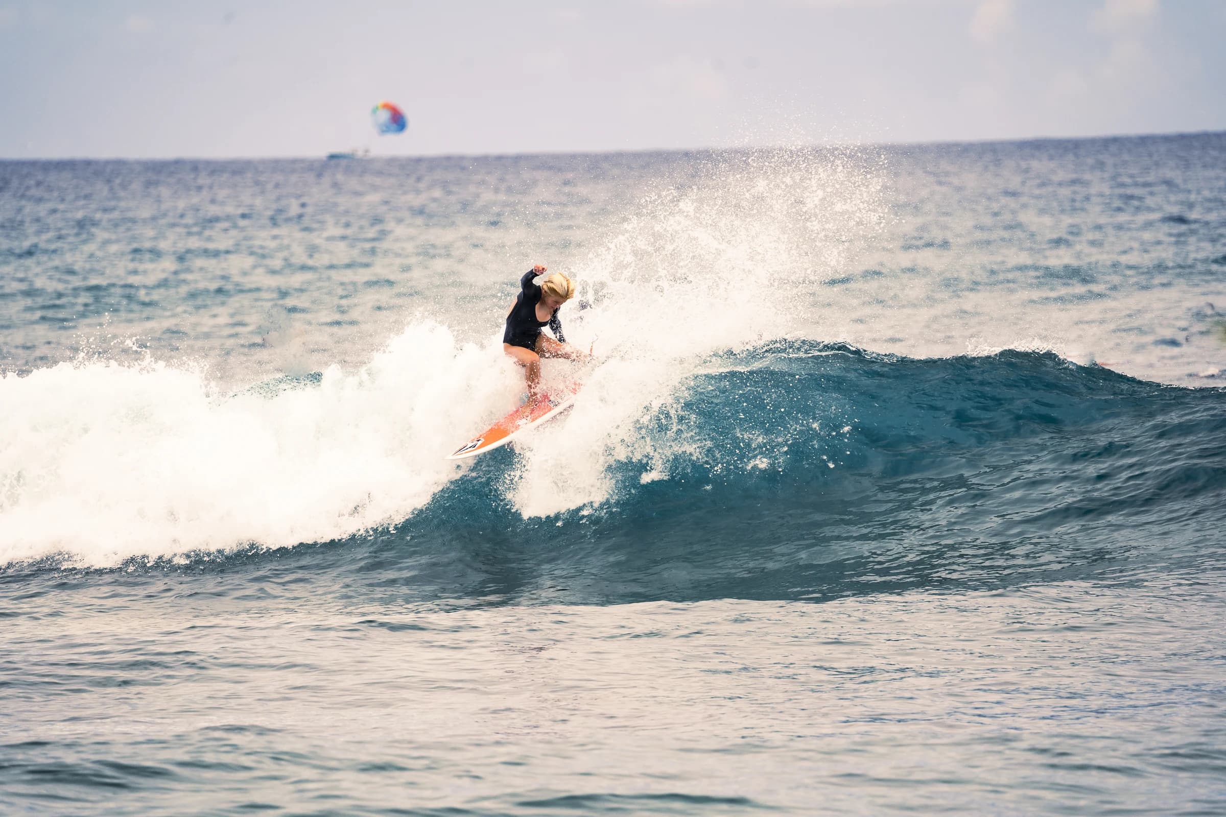Surfer balancing on a breaking wave